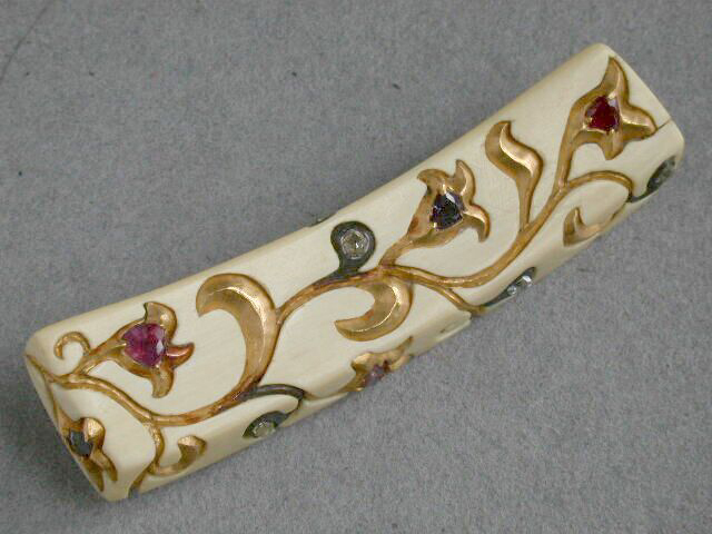 picture of fossil ivory, gems and 24K gold brooch