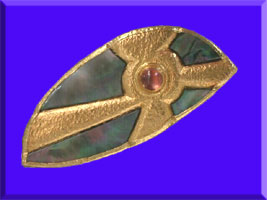 picture of carved black mother of pearl, gem stone and 24K gold sunshine ray brooch