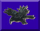 picture of carved ebony raven with 24K gold edging brooch