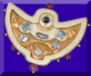 picture of carved fossil ivory, gems and 24K gold brooch
